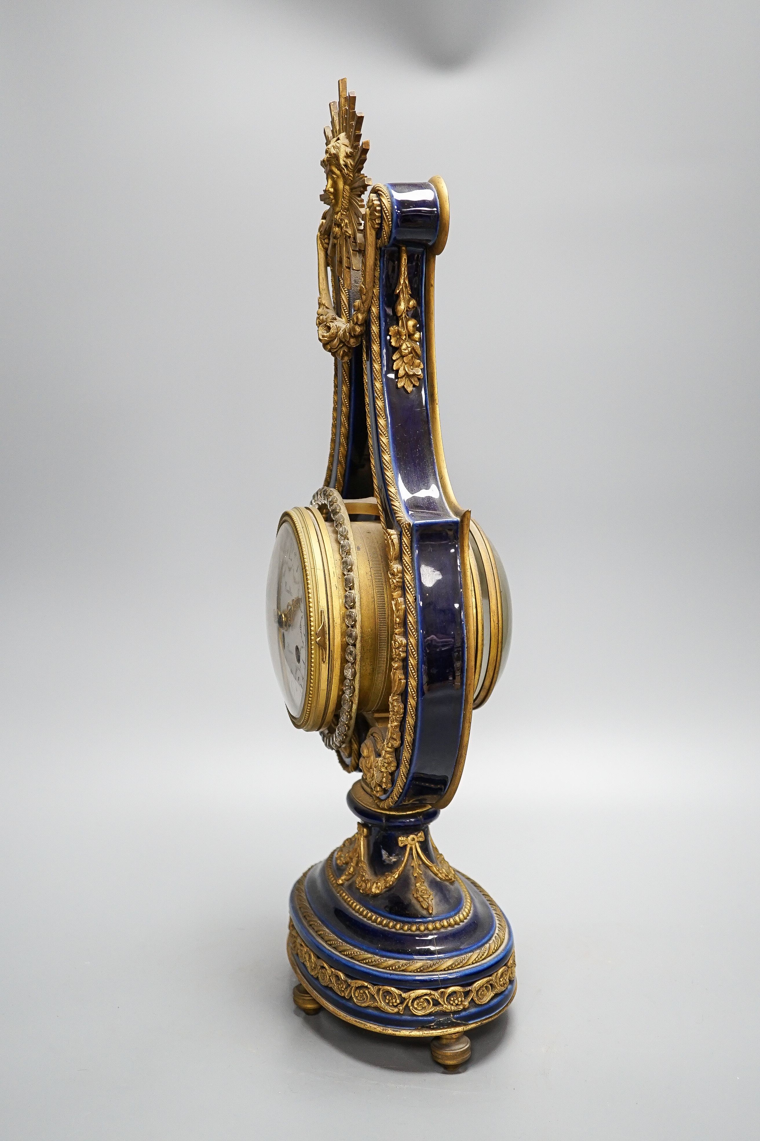 A Louis XV style ormolu mounted blue glazed porcelain lyre-shaped mantel clock (AF) 49cm, paste set surround to the pendulum